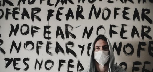 Fear no fear, motivational wall art with man in hoodie and face mask, positive message, hope, courage, mental strength, faith, resilience, inspirational quotes, community support, mental health awareness, personal growth.