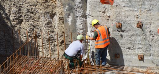 Reinforcing steel bars during construction at a job site for community development and infrastructure project.